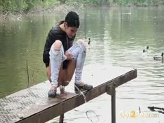 A gorgeous brunette with long legs and hair who is of legal age and produces water in public places is in her demins.